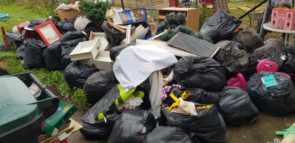 Bag pile awaiting collection on a Gravesend pavement — next-day rubbish removal by Andy