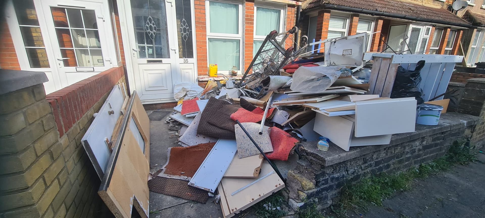 Driveway in Gravesend buried under carpet, MDF and an old mattress before Andy's house clearance van arrived