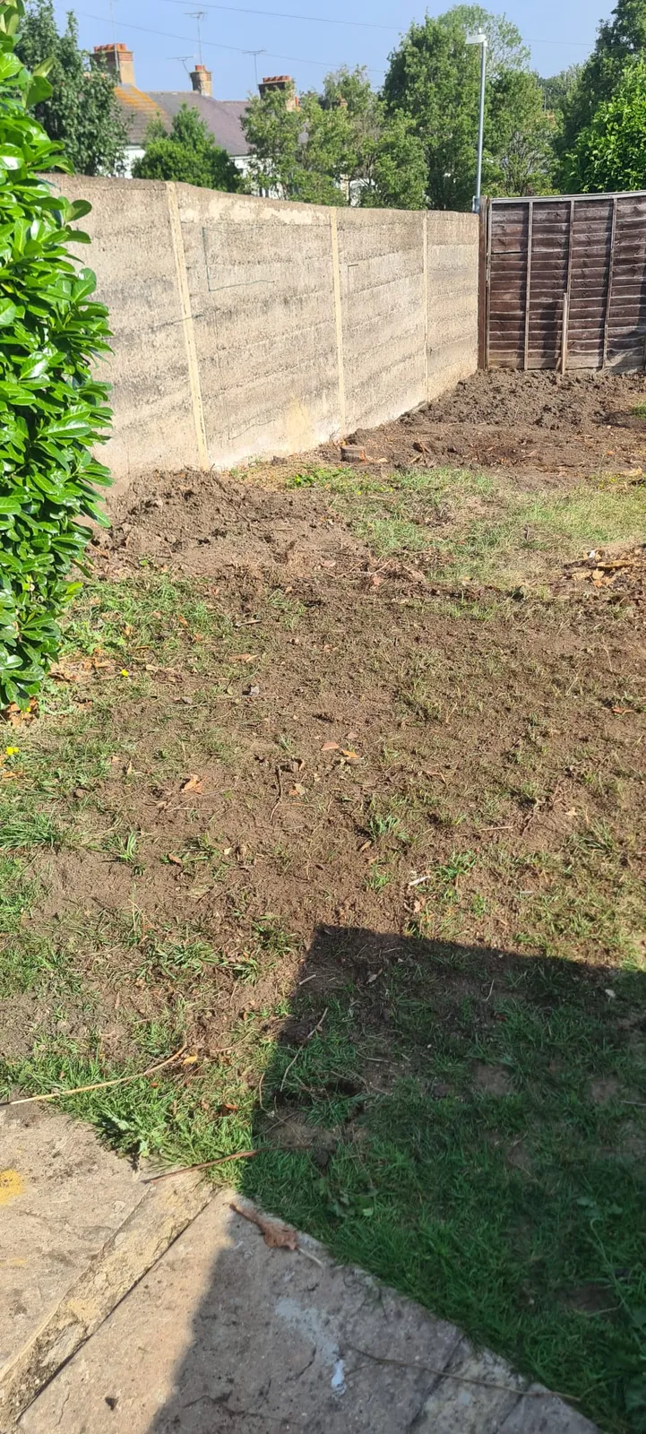 The same Gravesend back garden after Andy cleared the tree stump and rubble, the ground levelled off