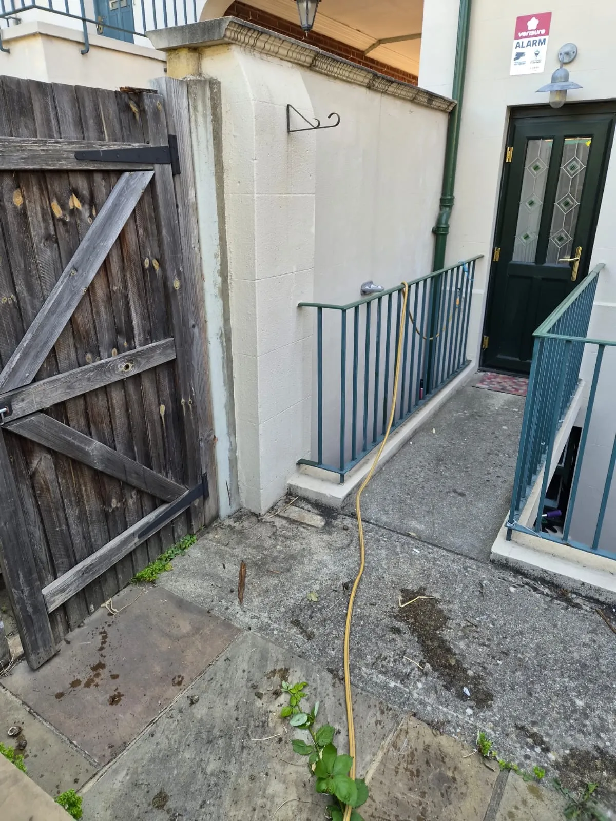 The same Northfleet flat entrance and side passage cleared by Andy, the path and doorway clear again