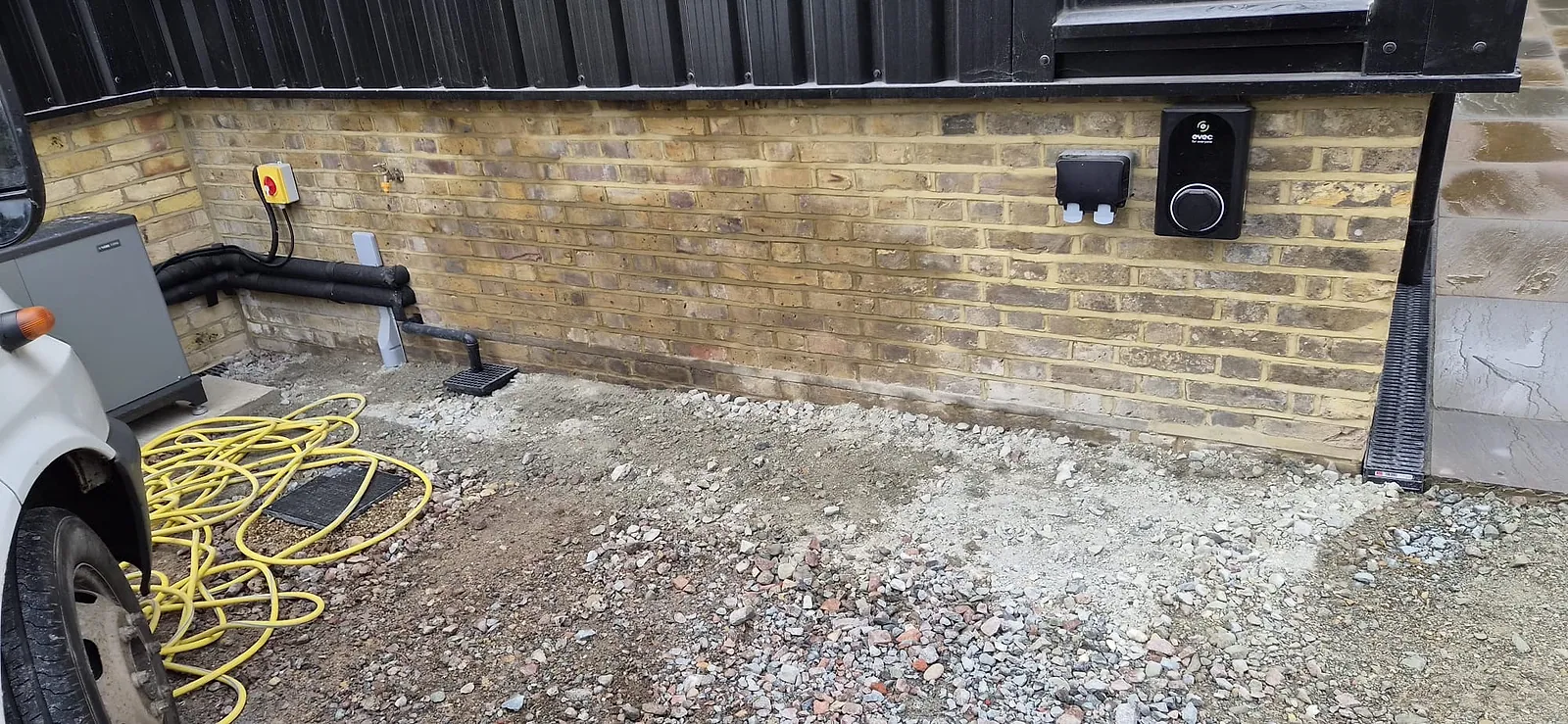 The same side of the extension in Gravesend cleared to gravel after the underlay and offcuts were taken away