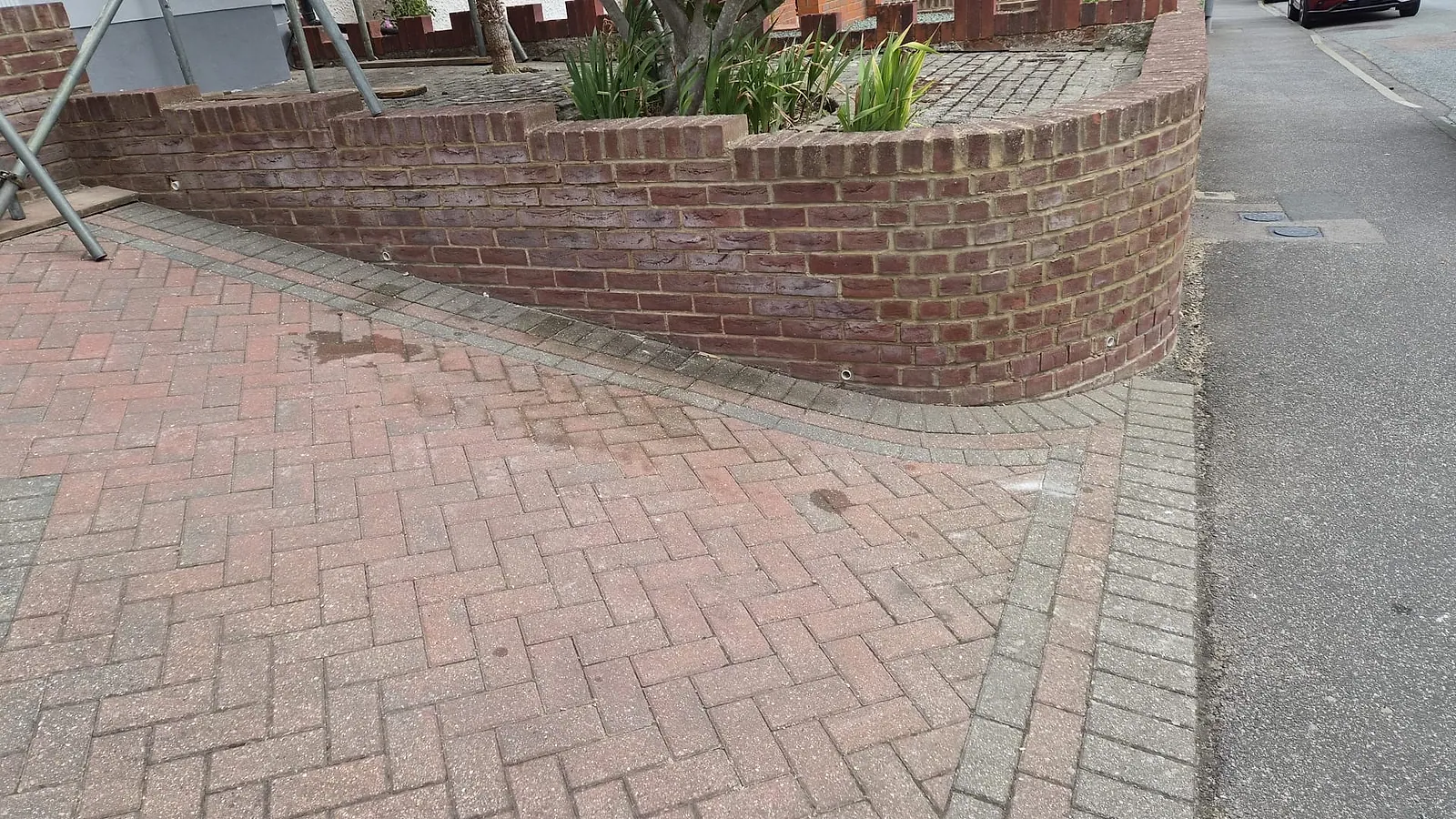 The same block-paved driveway in Gravesend swept clean with the pallet and plaster bags gone